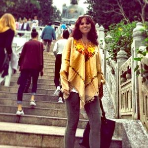 Tan embroidered poncho.