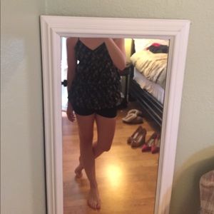 Black floral ruffled top.