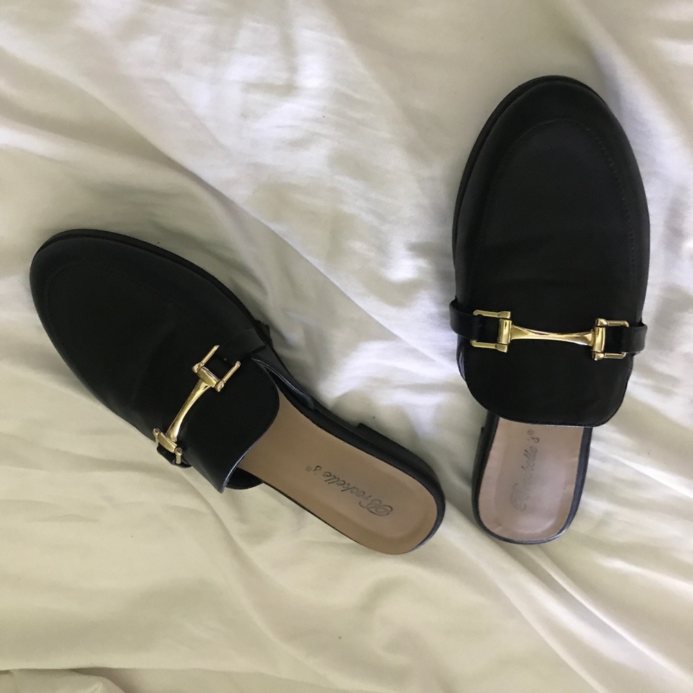 Black mule slides.