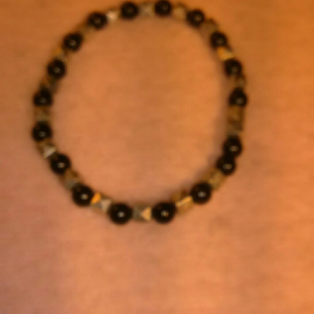 Silver and black stretch bracler