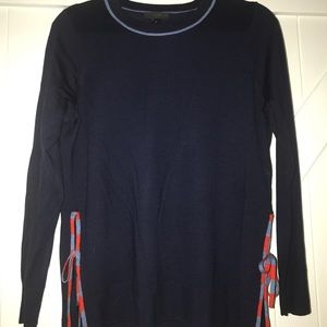 Sweater with slits and bows