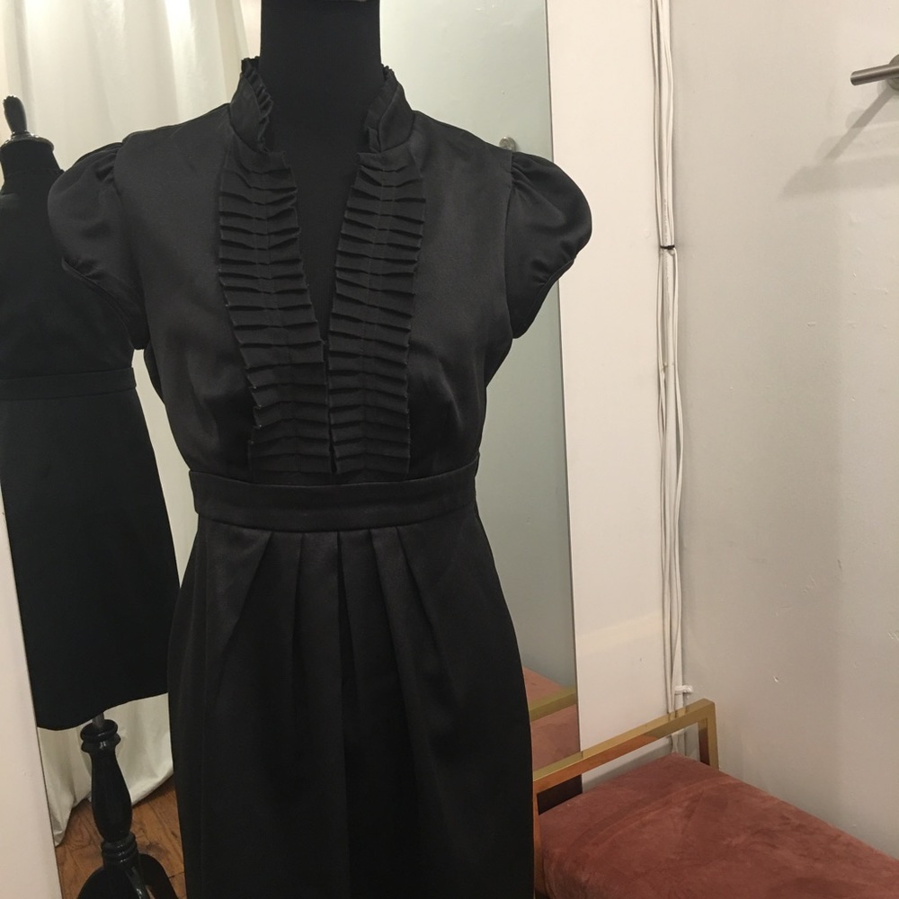 Black fitted dress with ruched neckline