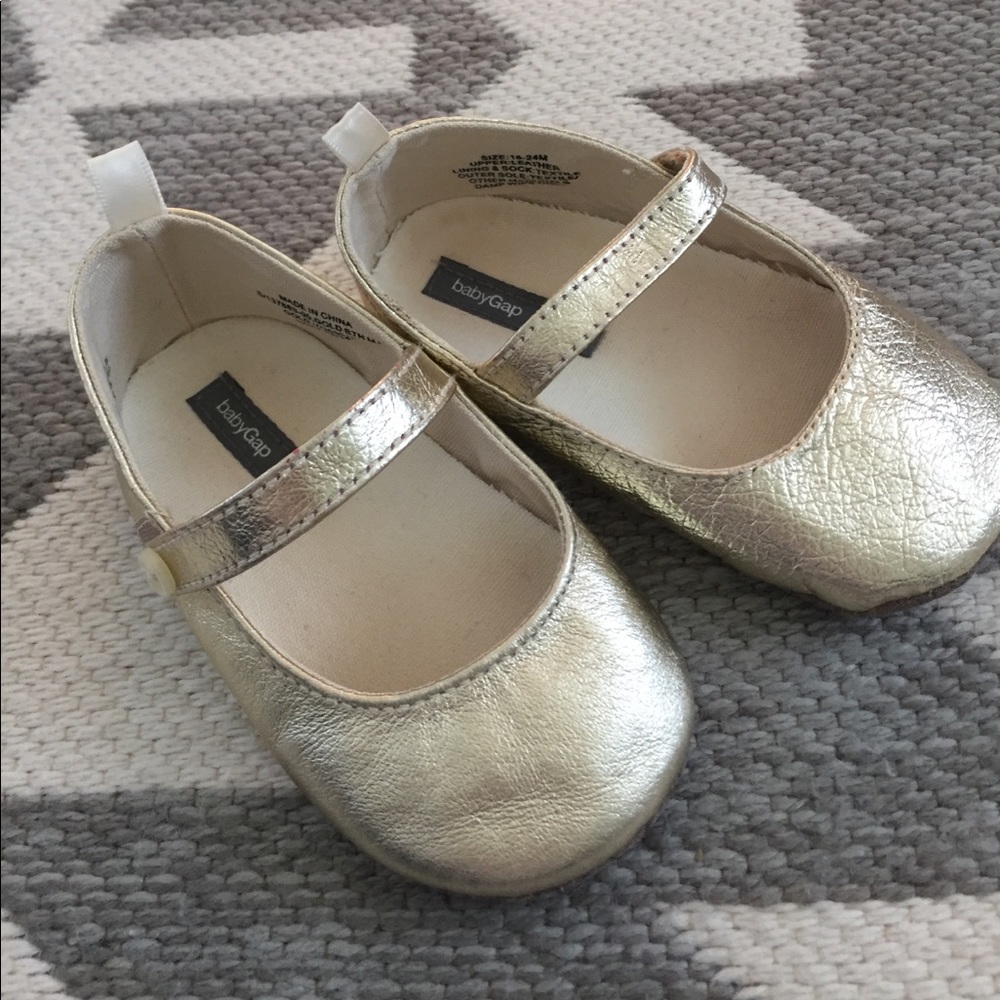 Gold Mary Jane shoes.