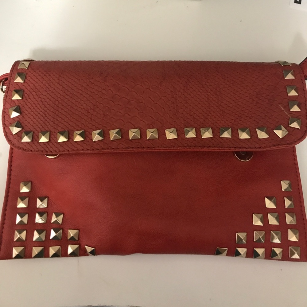 Orange studded clutch and cross body