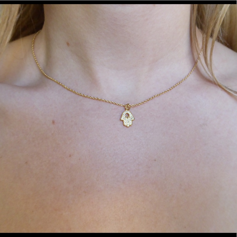 Tiny gold hand necklace