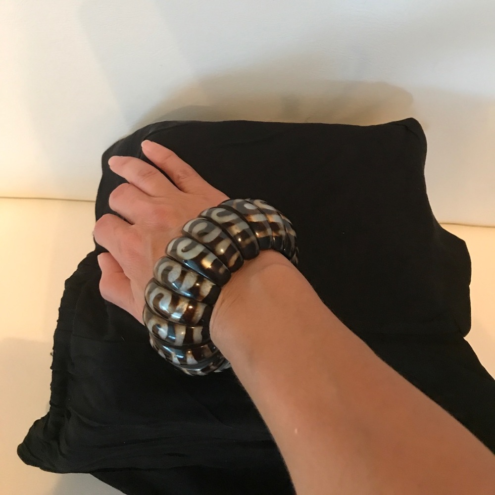 Silver black and gold exotic bracelet.