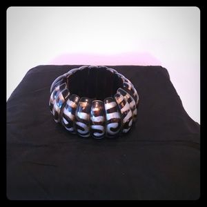 Silver black and gold exotic bracelet.