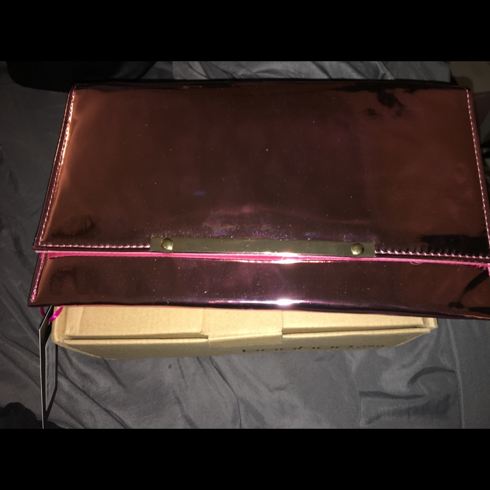 Metallic pink clutch with detachable chain strap
