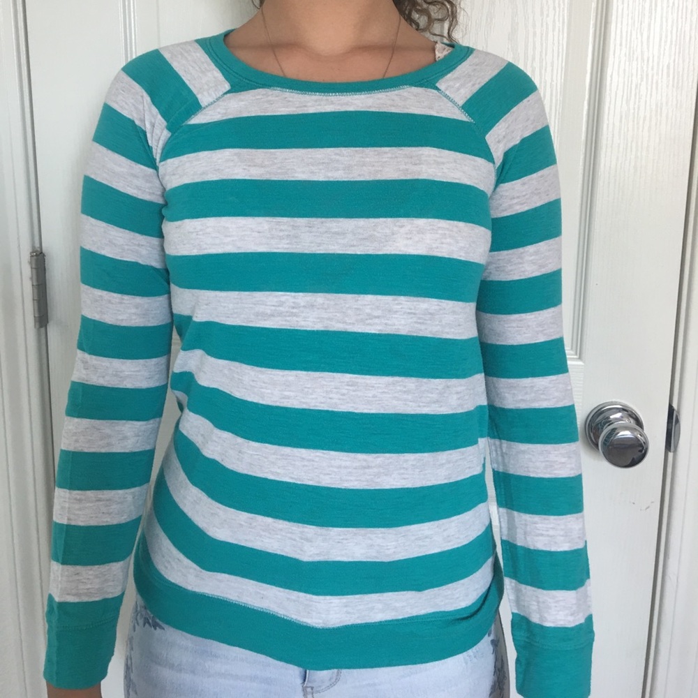 Gray and turquoise striped shirt.