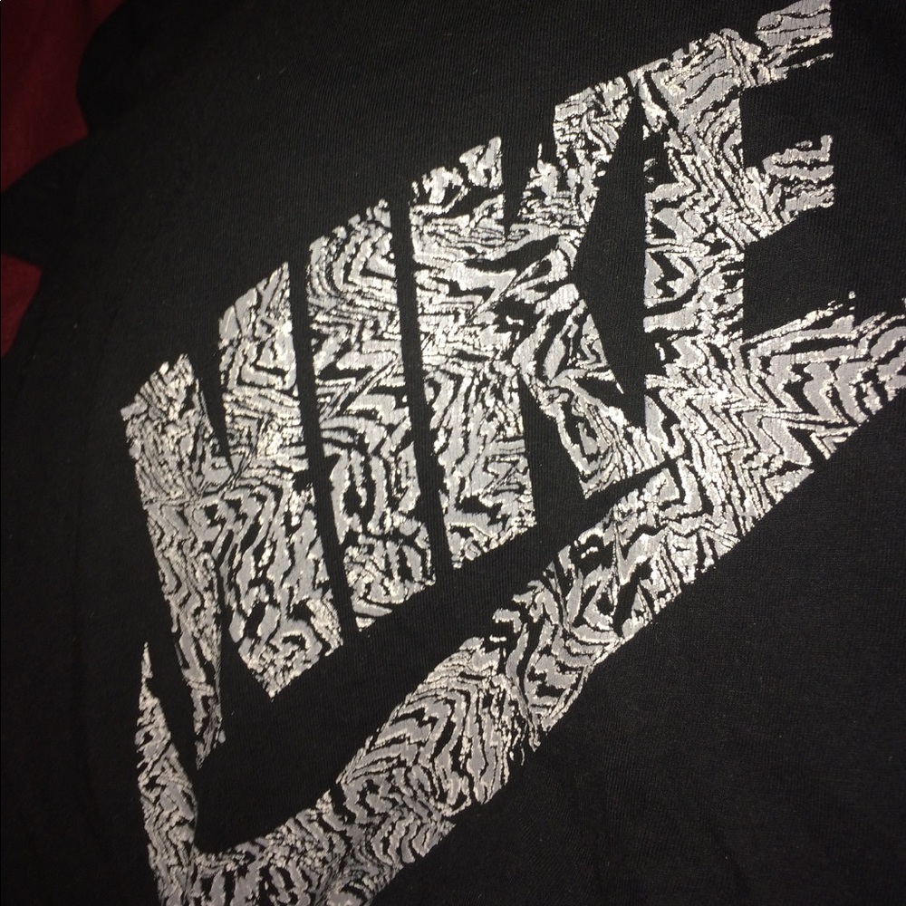 Black NIKE tee with white lettering