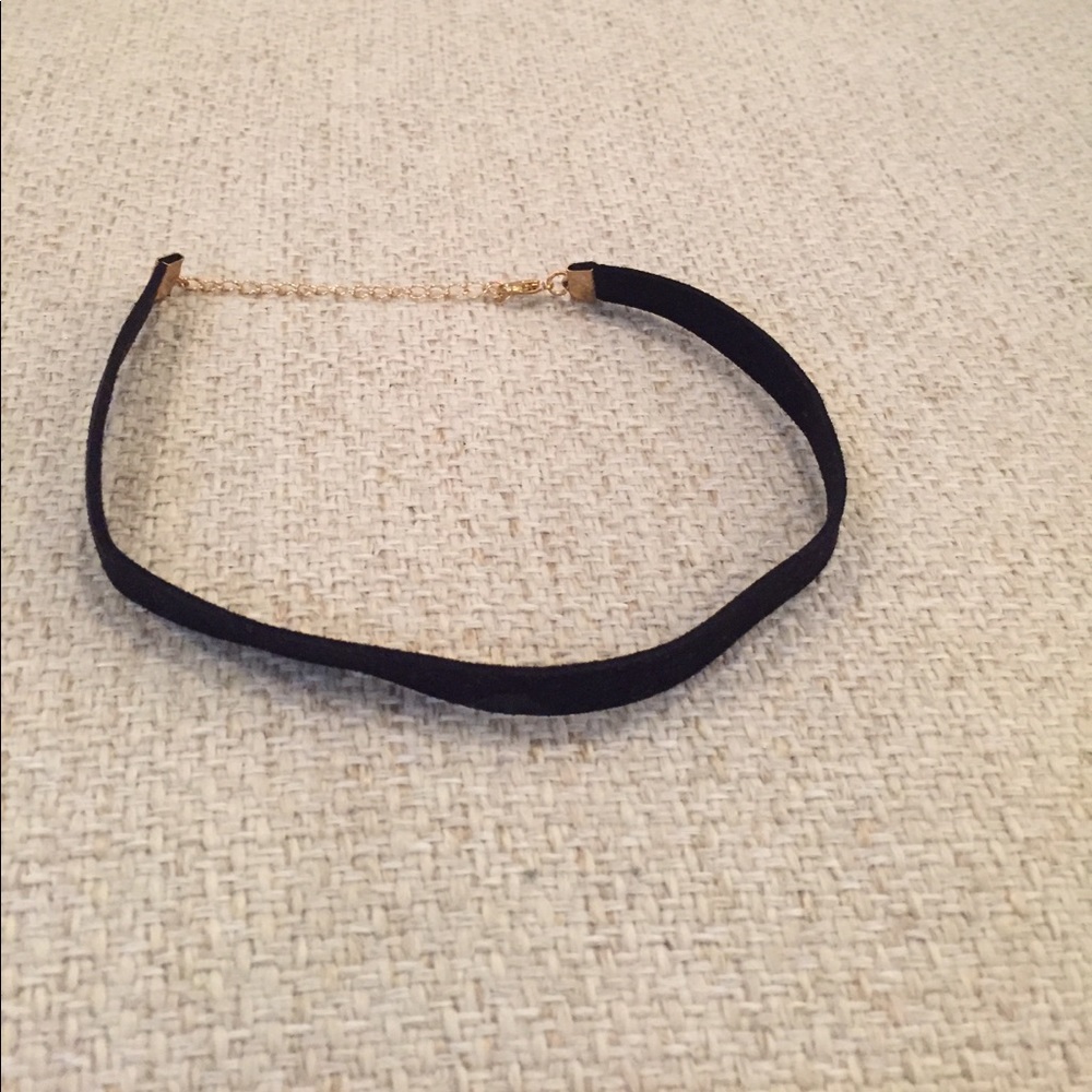 Black velvet choker with gold clasp