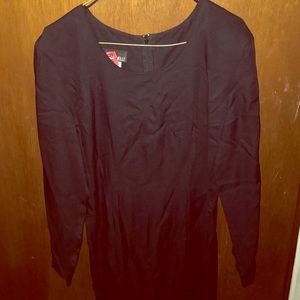 Long sleeved black gown.