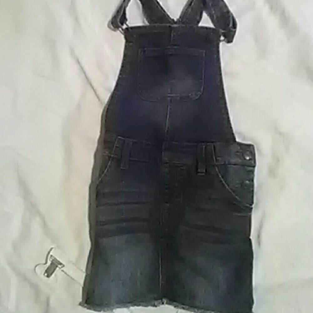 Its a little girls jean skirt suspenders in dark b