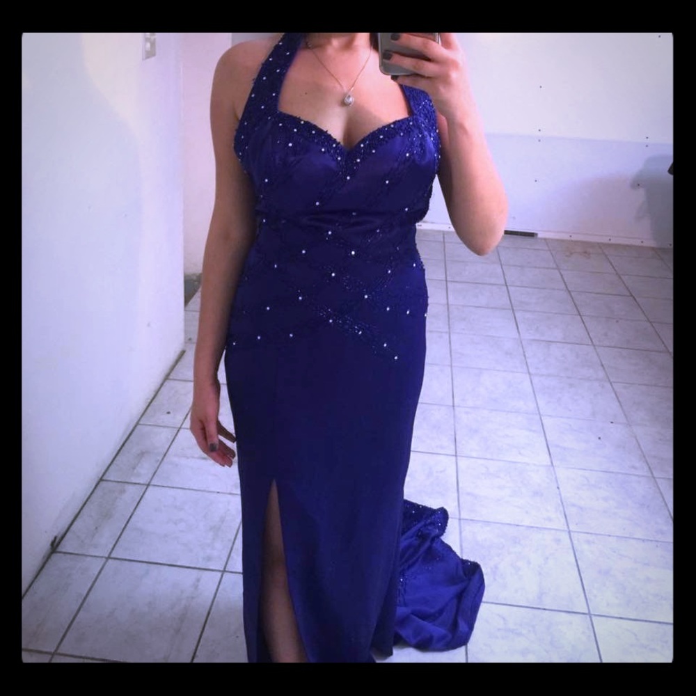 blue evening gown has a long train & slit