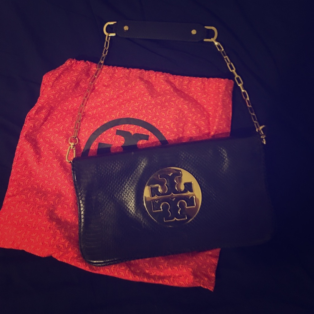 Tory Burch leather clutch  (almost new )