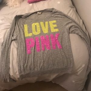 Grey long sleeve tee shirt with sequenced writing