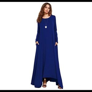 Blue draped dress with pockets. Dress is long