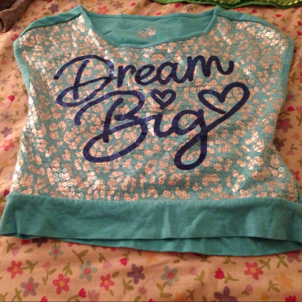 I'm selling a basic Justice Top that is blue