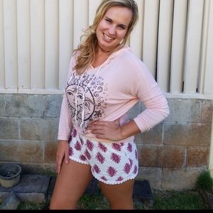 Super cute white shorts with rose print.