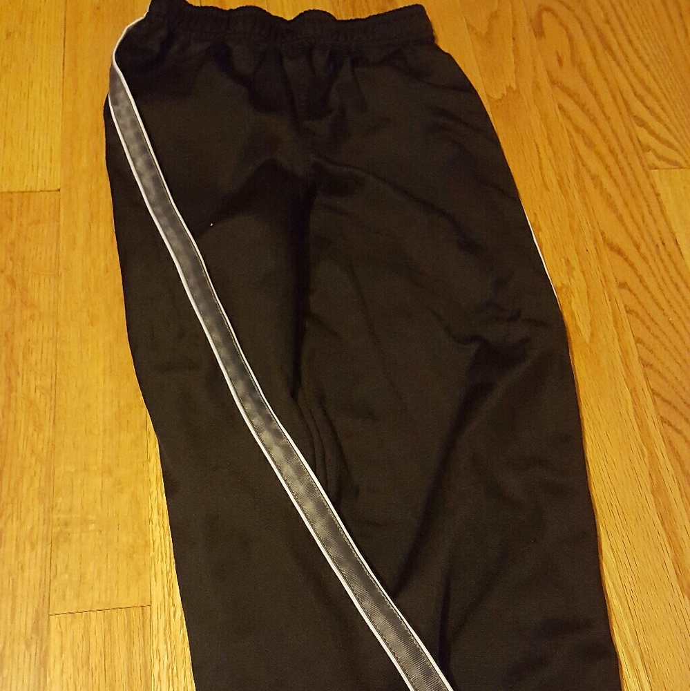 Boys black athletic pants with a gray stripe