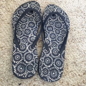Blue and white flip flops