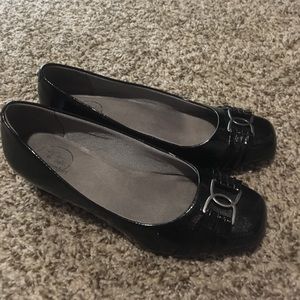 Wedge heel Lifestride patent leather shoes.