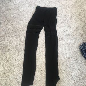 Black leggings with mesh cuts in the knees