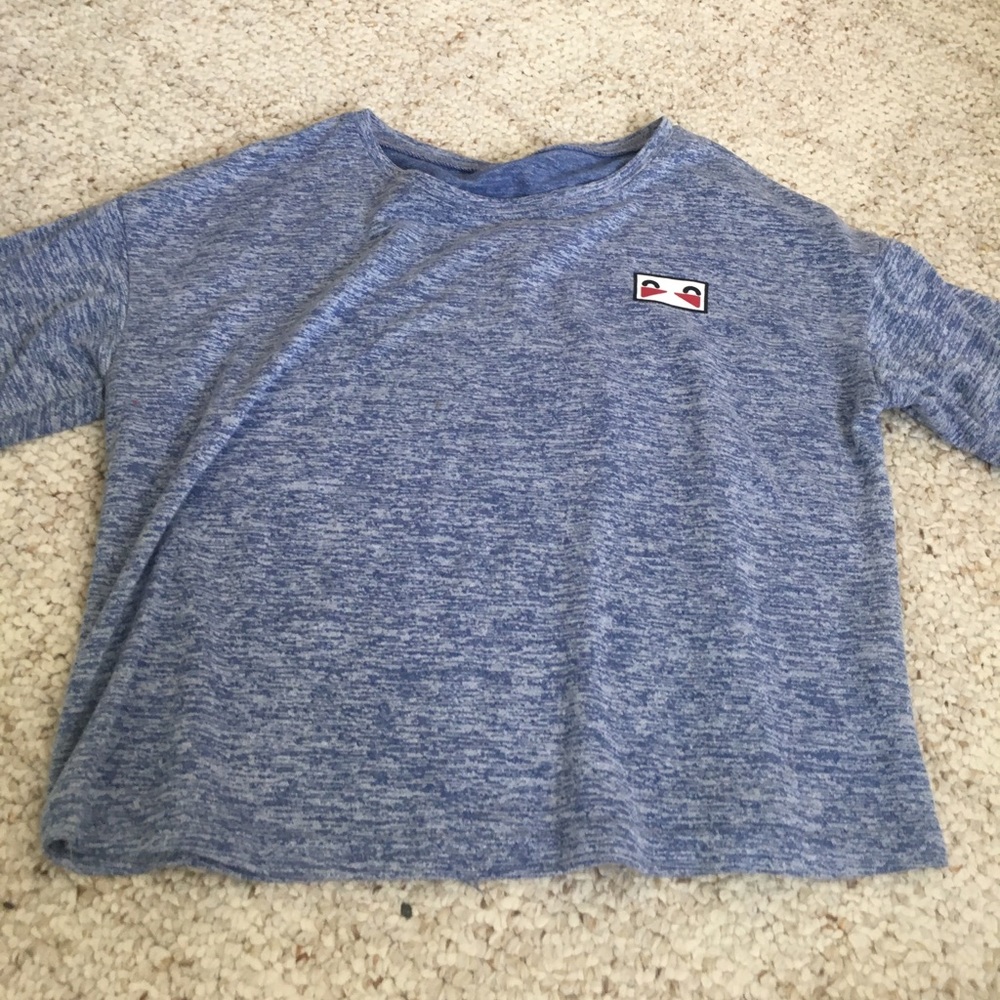 Blue short sleeved tee with small design in corner