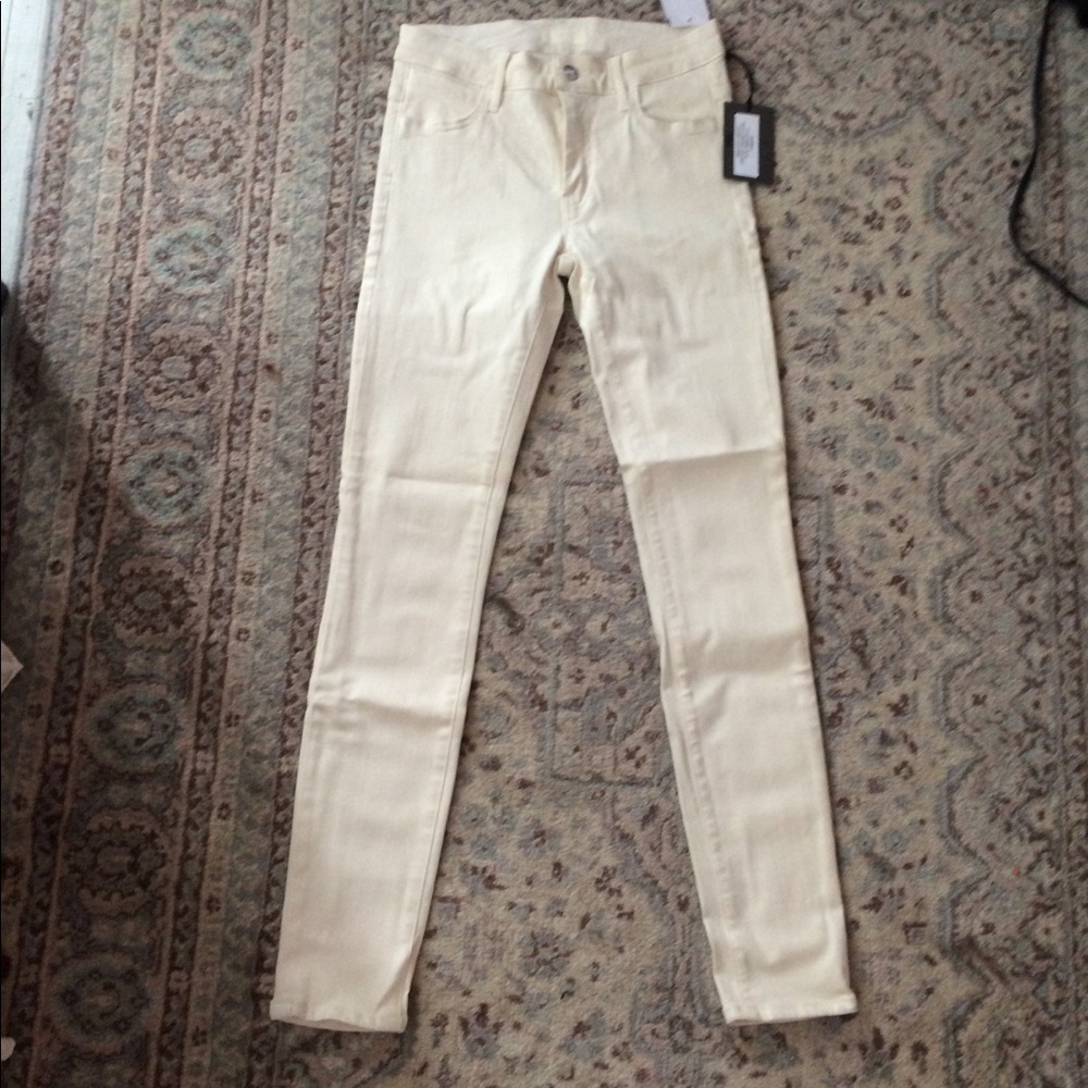 KORAL brand cream skinny jeans.