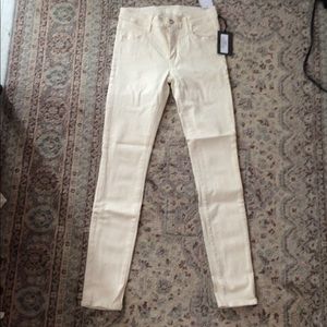 KORAL brand cream skinny jeans.