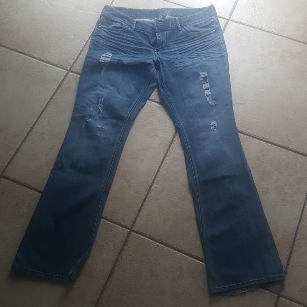 Distressed jeans with leopard print under