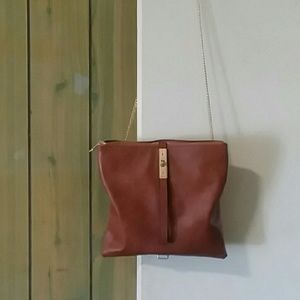 Brown cross body purse with golden strap