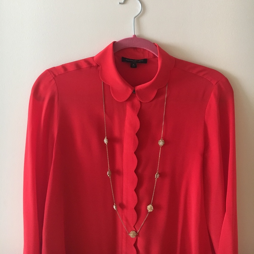 Red silk blouse with scallop detail