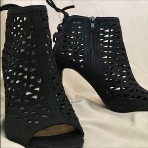 pair of black peep toe booties