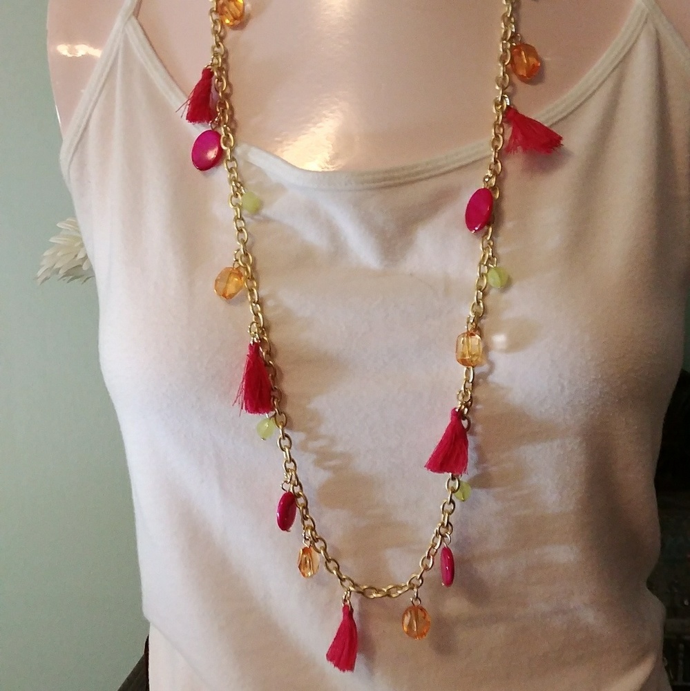 Gold tone long tassel necklace