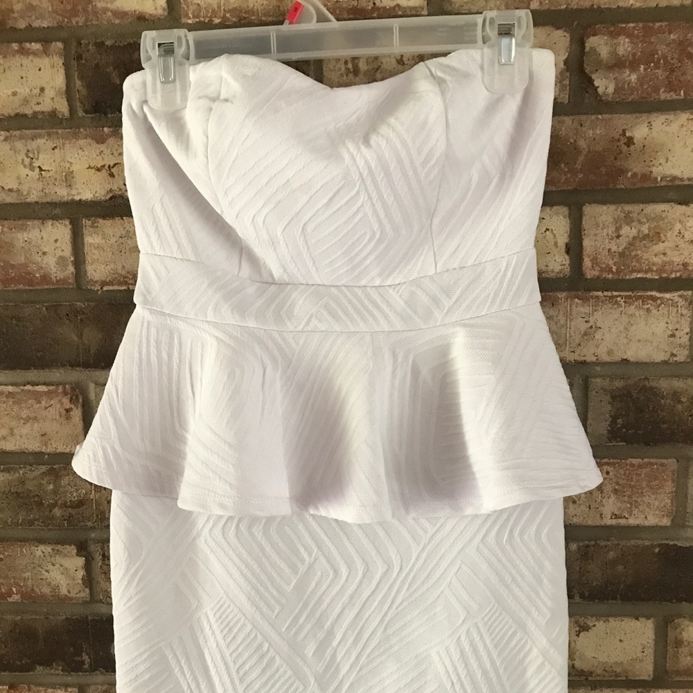 Body con white peplum dress