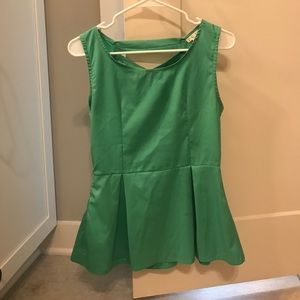 Green sleeveless shirt with crisscross back