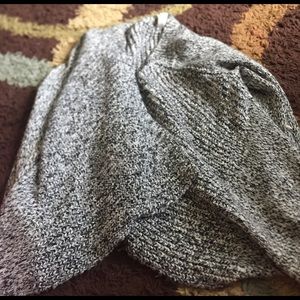 A gray and black and white cardigan