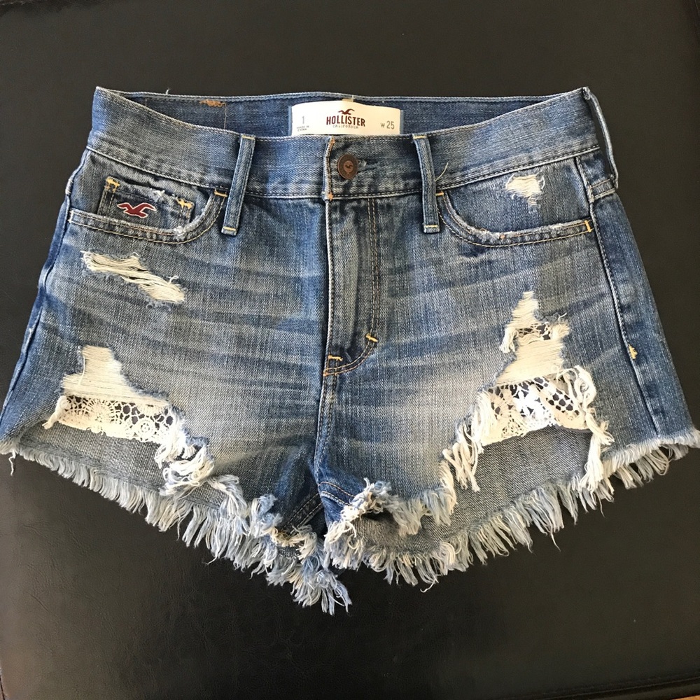 High waisted distressed shorts with lace. Size 1