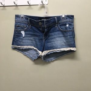 Denim shorts with lace on bottom
