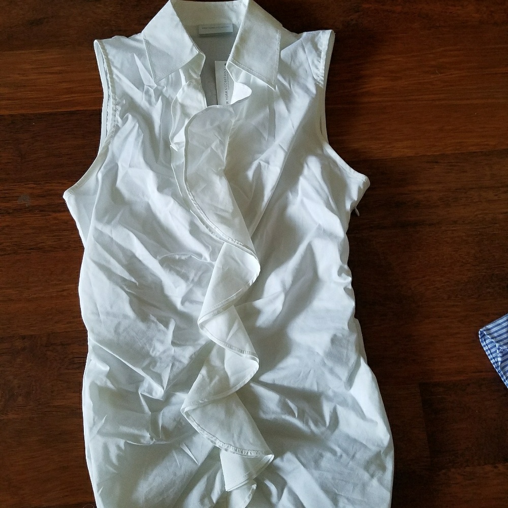 White ruffled sleeveless blouse