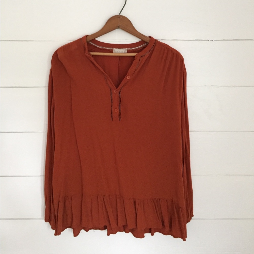 Burnt orange long sleeve peplum