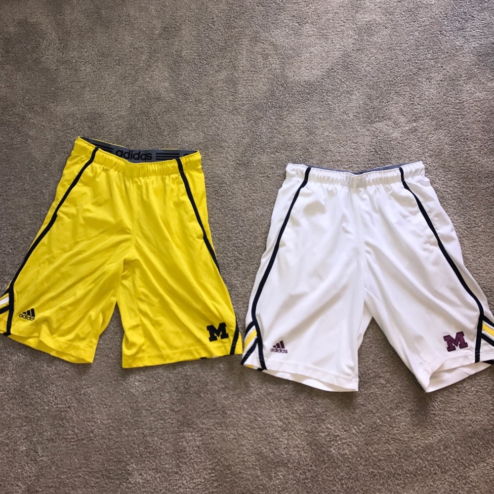 Two pair of Adidas U of M basketball shorts