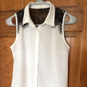 Sleeveless shirt with black embroidery