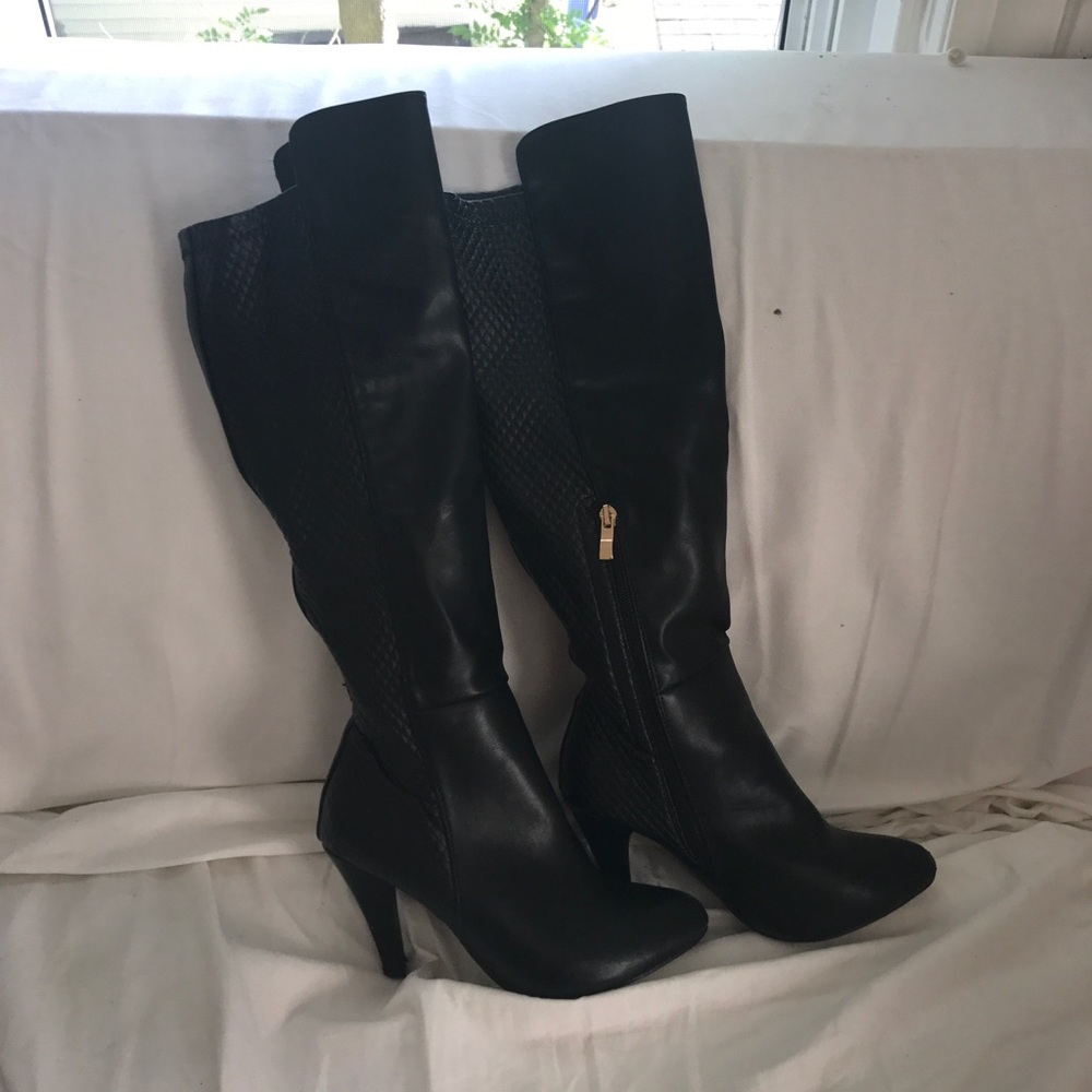 Tall black heeled boots