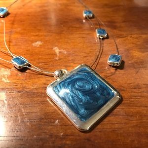 Skinny silver necklace with blue gems