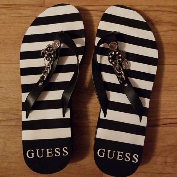 guess flip flops with charms