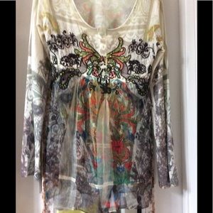 Colorful and sheer top.