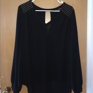 Sheer black top with gold accents