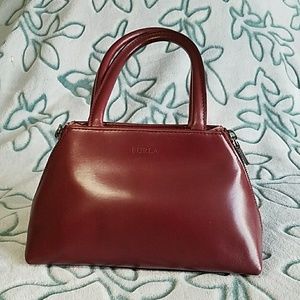 Elegant Furla deep red tote with side zippers